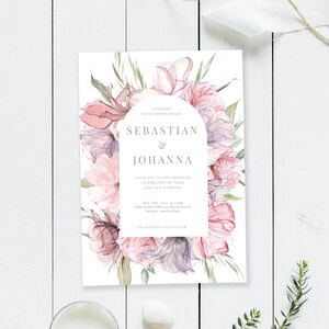 May include: Wedding invitation with a floral design featuring pink and purple flowers. The invitation reads "Together with their families, Sebastian & Johanna, Invite you to join them for celebration of their love and marriage, May 23th, 2021, at 4 pm, Sanctuary Park, 620 Royal Street, Brydan, Amsterdam, Reception to follow."