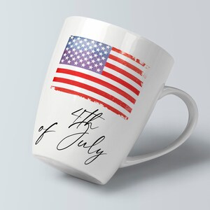 May include: White ceramic mug with a red, white, and blue American flag design and the text "4th of July" in black cursive script.