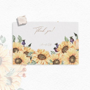 May include: A thank you card with a watercolor illustration of sunflowers and greenery. The text on the card reads "Thank you!" and "Sincerely Yours".
