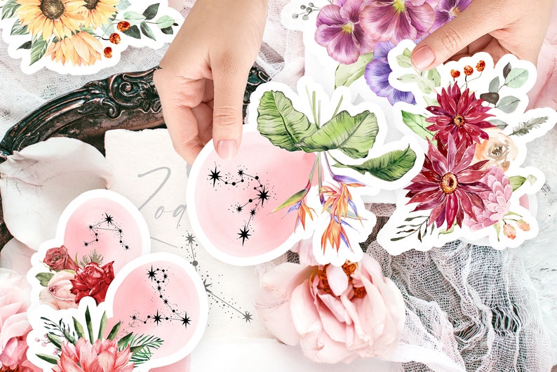 May include: A set of watercolor stickers featuring zodiac constellations, flowers, and tropical plants. The stickers are on a pink background with a white border.