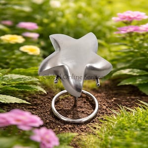 Urna de cremación para cenizas con recuerdo de estrella pequeña en diseño gris brillante.