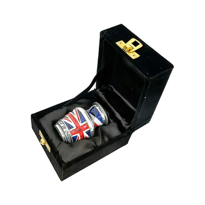 May include: A small silver urn with a Union Jack design. The urn is in a black velvet box with a gold latch.