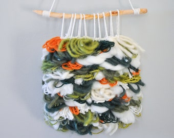 woven green and orange floral abstract boho style shag wall hanging