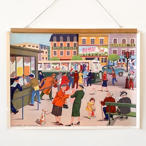 May include: A vintage French educational poster depicting a busy city street scene with a bus stop, people waiting for the bus, and various shops and businesses. The poster features the text "A L'ARRET DE L'AUTOBUS", "HOTEL DE LA GARE", "BAMBI CINEMA", and "ASSURANCES-VIE".