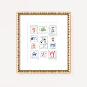 May include: A framed print featuring a collection of watercolor postage stamps with a coastal theme. The stamps depict seashells, fish, a crab, a starfish, and a lobster. The frame is gold with a decorative edge.