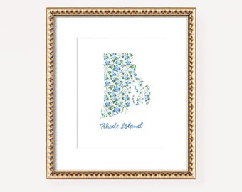 May include: A framed print of the state of Rhode Island, outlined in a floral pattern with blue and white flowers. The print is in a gold frame with a decorative border. The text "Rhode Island" is printed below the state outline.
