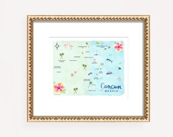 May include: A framed map of Cancun, Mexico, featuring a watercolor design with blue and green hues. The map includes illustrations of local landmarks, flora, and fauna. The word "Cancun" is written in a cursive font. The frame is gold.