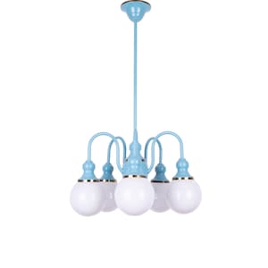 May include: A light blue chandelier with five white globe-shaped light bulbs. The chandelier has a gold trim around the base of each bulb.