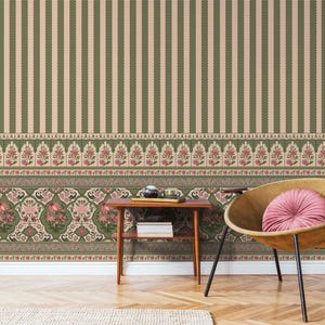 May include: Wallpaper featuring a vertical striped pattern in olive green and cream, with a horizontal border below displaying a repeating floral motif in pink, green, and cream colors. The design includes intricate botanical details and patterns.
