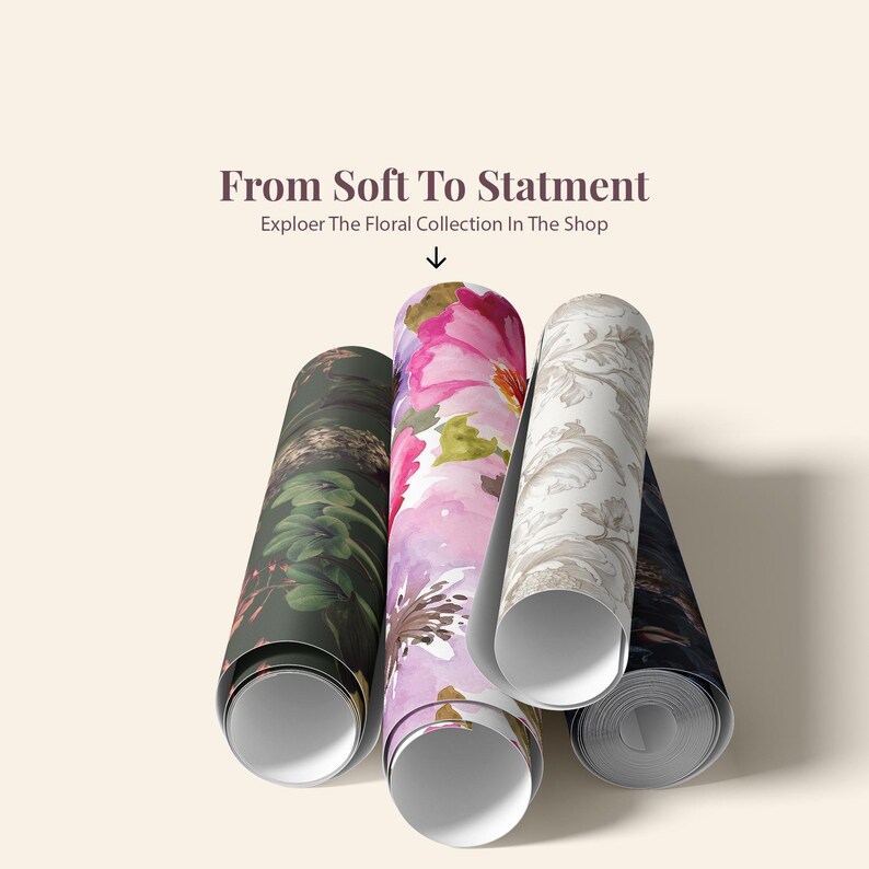 May include: Four rolls of wallpaper featuring diverse floral and botanical patterns in dark green, vibrant pink, and neutral beige tones. The text above reads From Soft To Statment and Exploer The Floral Collection In The Shop with an arrow.