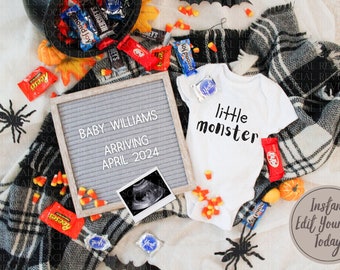 May include: A gray letter board with the text "Baby Williams Arriving April 2024". A white onesie with the text "little monster" is next to the letter board. The onesie is surrounded by candy corn and a black and white plaid blanket. There is a black spider and a black bat on the blanket.