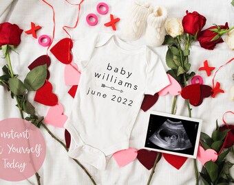 May include: White onesie with the text "baby williams june 2022" and an arrow with a heart. The onesie is surrounded by red and pink hearts, roses, and a white knitted bootie. There is also a black and white ultrasound image.