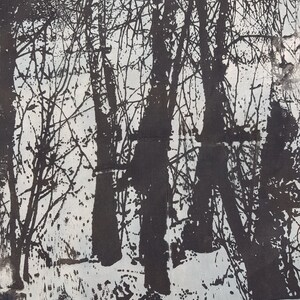 May include: A black and white abstract print of trees in a forest. The trees are silhouetted against a white background. The print has a textured look, as if it were made with a brush or a sponge.