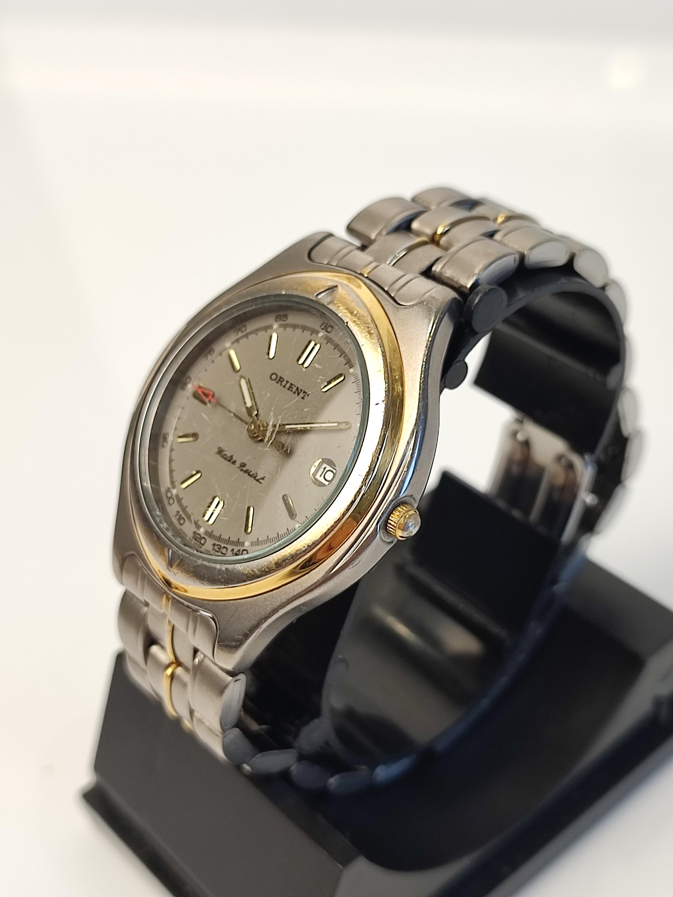 Vintage Orient Titanium Quartz Watch: Japan Made Men's Date