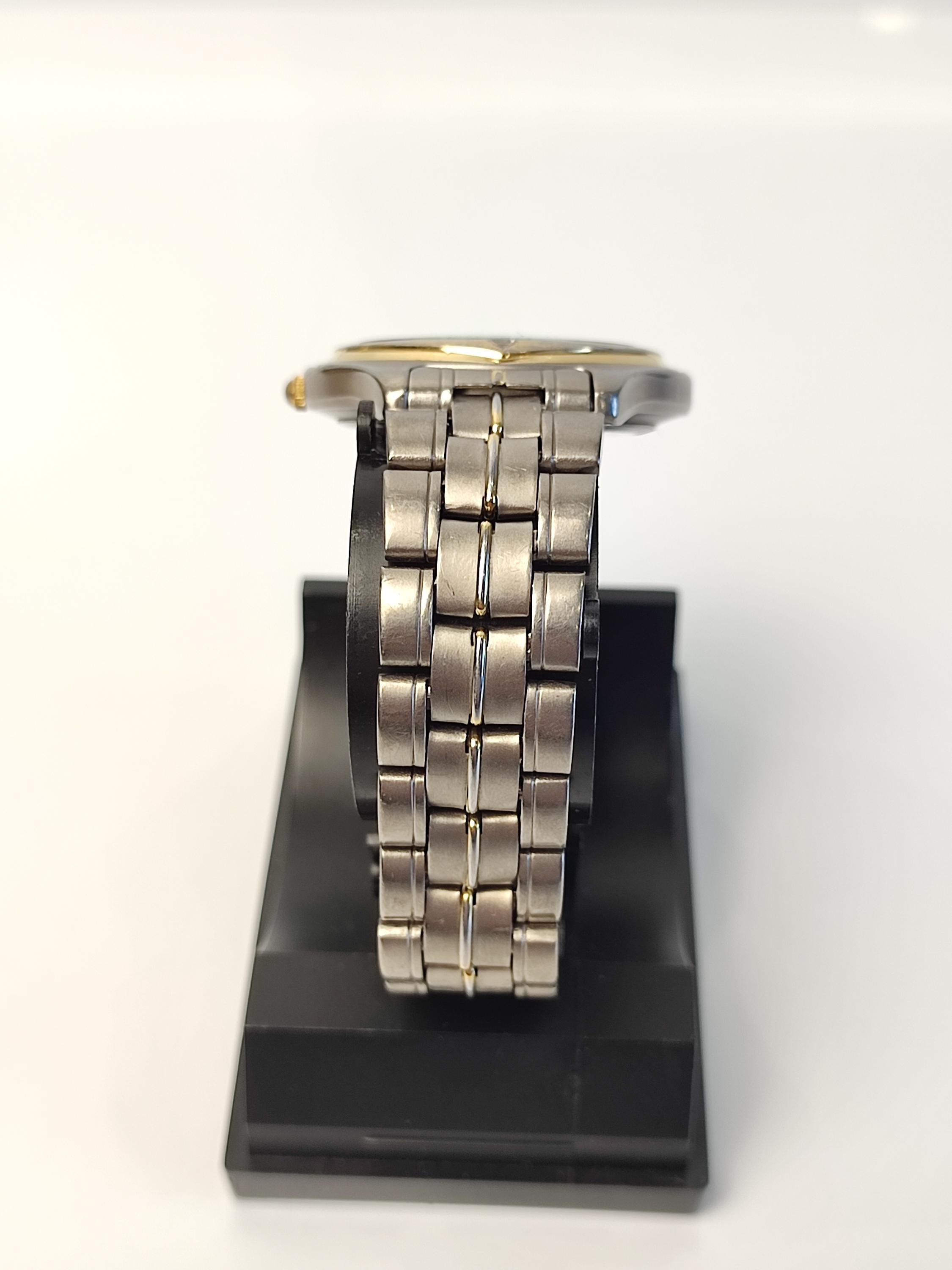 Vintage Orient Titanium Quartz Watch: Japan Made Men's Date