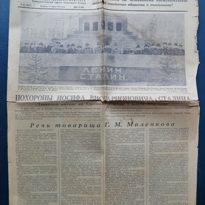 May include: A vintage black and white newspaper page titled Pravda, dated March 10, 1953. It features a large photograph of a crowd at a funeral, the names Lenin and Stalin, and a headline about the funeral of Joseph Vissarionovich Stalin.