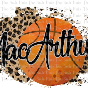 May include: A basketball with an orange and brown watercolor design, with the name "MacArthur" written in black cursive script over the ball. The background is a brown and black leopard print.