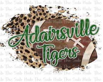 May include: A brown and white football with a green and white leopard print background. The text "Adairsville Tigers" is written in green and white on the football.