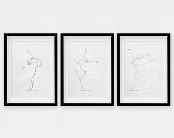 Può includere: Tre stampe incorniciate in nero di disegni a linea di ballerini in varie pose. Le stampe sono appese a un muro bianco.