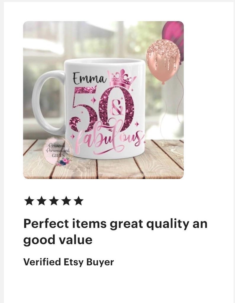 May include: White ceramic mug with the text "Emma 50 & Fabulous" in pink glitter lettering. The mug has a handle and a crown design above the number 50. Two balloons are in the background.
