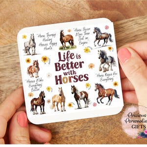 May include: A white square coaster with the text "Life is Better with Horses" and various horse illustrations. The coaster also includes phrases like "Horse Therapy Heals Happy Hearts."