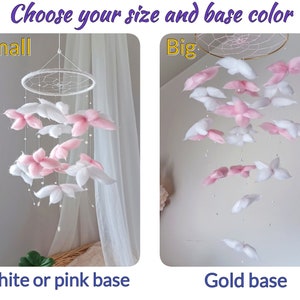 May include: Two hanging mobiles with white and pink fabric flower shapes suspended from circular frames. The text reads Choose your size and base color, Small, Big, White or pink base, and Gold base. The small mobile has a white frame, while the big mobile features a gold frame with white and pink floral elements.
