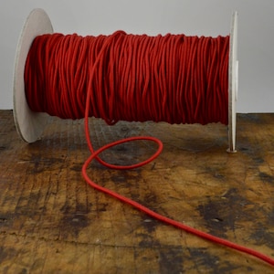 Cordón elástico de algodón orgánico rojo de 2,2 mm de ancho
