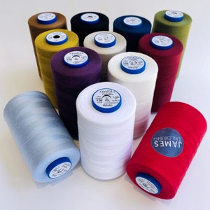 May include: A collection of 10 spools of thread in various colours, including white, red, blue, green, brown, and purple. Each spool is labelled "Craftil Colorfil 120" and includes the colour name. The spools are arranged in a circle on a white surface.