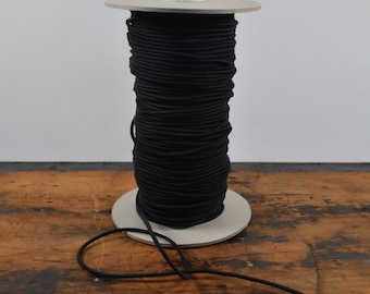 Cordón elástico de algodón orgánico GOTS negro de 2,2 mm