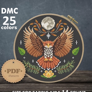 May include: Cross stitch pattern featuring a brown and orange owl with outstretched wings, flying under a full moon. The owl is surrounded by green leaves and branches. The pattern is designed for Aida 14 count fabric and measures 7.57 x 7.79 inches or 19.23 x 19.78 cm. The pattern requires 25 DMC colors.