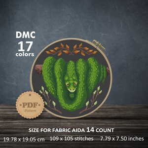Op de afbeelding: Een kruissteekpatroon met een groene slang die in een hartvorm is opgerold met bruine takken en bladeren. Het patroon is voor Aida 14 count stof en meet 7,79 x 7,50 inch of 109 x 105 steken. Het patroon vereist 17 DMC kleuren.
