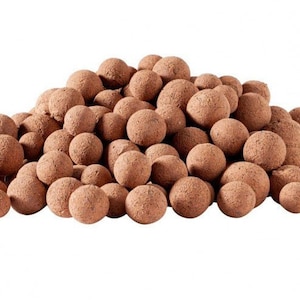 May include: A pile of brown clay pebbles, also known as hydro balls, used for growing plants in hydroponic systems.