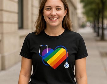 May include: A black t-shirt with a rainbow heart and a stethoscope. The heart is made up of the colors of the rainbow, with a purple stethoscope wrapped around it.