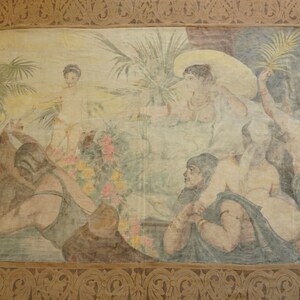 May include: A vintage tapestry depicting a group of people in a tropical setting. The tapestry features a variety of colors, including beige, brown, and green. The people are dressed in flowing robes and are surrounded by lush foliage. The tapestry is framed in a brown wooden frame.