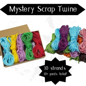 May include: A box of 10 strands of colorful scrap twine, each strand is approximately 10 yards long. The twine is arranged in a box and includes colors like red, green, blue, yellow, purple, and brown.  Mystery Scrap Twine, 10 strands, 10+ yards total!