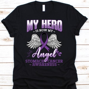Meu herói é agora meu anjo camisa, presente de conscientização do câncer para o sobrevivente do lutador guerreiro do câncer de estômago, camiseta com fita de câncer de estômago