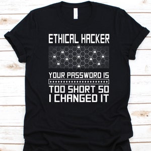 May include: Black t-shirt with white text that reads "ETHICAL HACKER" above a graphic of padlocks and the text "YOUR PASSWORD IS TOO SHORT SO I CHANGED IT."