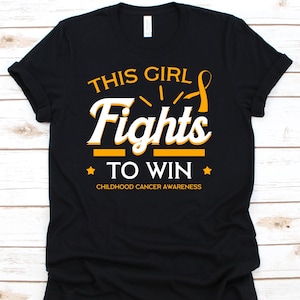 This Girl Fights To Win Shirt, Childhood Cancer Ribbon Awareness Support For Children, Kids Cancer Shirt, Fight Like A Kid Gift