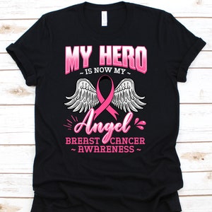 Meu herói agora é meu anjo, camiseta de conscientização sobre o câncer para o sobrevivente do guerreiro guerreiro do câncer de mama, camiseta com fita rosa para torcedor do câncer de mama