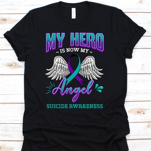 Mi héroe es ahora mi camisa de ángel, succión de la concienciación de suicidio camiseta para los hombres mujeres que luchan contra la depresión, la idea de regalo de la camiseta de la prevención del suicidio