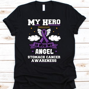 Meu herói é agora meu anjo camisa, presente de conscientização do câncer para o sobrevivente do lutador guerreiro do câncer de estômago, camiseta com fita de câncer de estômago