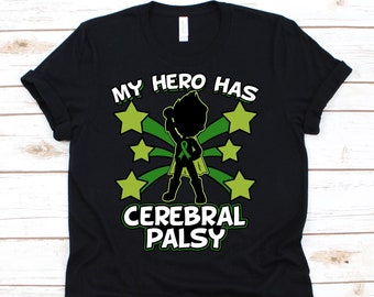 May include: Black t-shirt with the text "MY HERO HAS CEREBRAL PALSY". The design features a superhero figure with a green ribbon, surrounded by green stars and radiating lines. The shirt is made of a soft material.