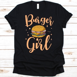 バーガーガールシャツ、女性向けのかわいいバーガーデザイン、グルメへのギフト、ハンバーガーを食べる人のグラフィック、バーガー好きのグラフィック、ビーフバーガー、スナックTシャツ