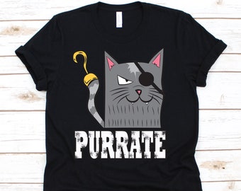 May include: Black t-shirt featuring a gray cat with an eye patch and a gold hook for a paw. The cat has a mischievous expression. The word "PURRATE" is printed in white block letters below the cat.