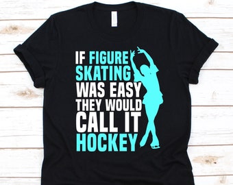 May include: Black t-shirt with the text "IF FIGURE SKATING WAS EASY THEY WOULD CALL IT HOCKEY" in white and turquoise. A turquoise figure skater silhouette is on the right side of the text. The shirt has short sleeves and a crew neck.
