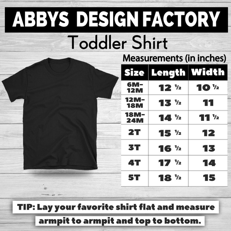 K&ouml;nnte beinhalten: Schwarzes Kleinkind-T-Shirt mit einer Gr&ouml;&szlig;entabelle mit Ma&szlig;en in Zoll. Die Tabelle enth&auml;lt Gr&ouml;&szlig;en von 6M-12M bis 5T mit entsprechenden L&auml;ngen- und Breitenma&szlig;en. Der Text "ABBY'S DESIGN FACTORY" steht oben.