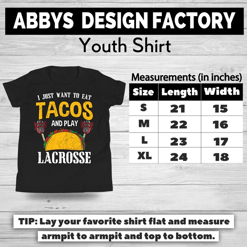 May include: Black youth shirt with the text "I JUST WANT TO EAT TACOS AND PLAY LACROSSE". The shirt includes a graphic of a taco and lacrosse sticks. Measurements are provided in inches.