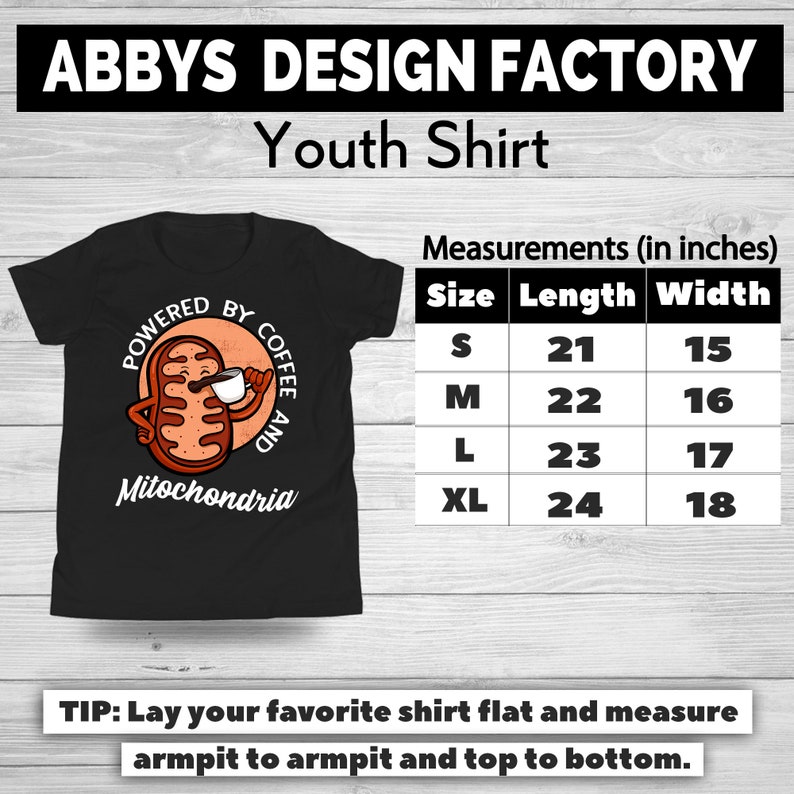 May include: Black youth shirt with a cartoon illustration of a mitochondria holding a coffee cup, with the text "POWERED BY COFFEE AND Mitochondria." Measurements are provided in inches: S (21" length, 15" width), M (22" length, 16" width), L (23" length, 17" width), XL (24" length, 18" width).