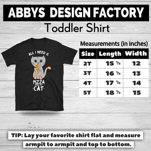 May include: Black toddler shirt with a graphic of a gray cat holding pizza and the text "ALL I NEED IS PIZZA AND MY CAT." Measurements are provided in inches for sizes 2T to 5T.