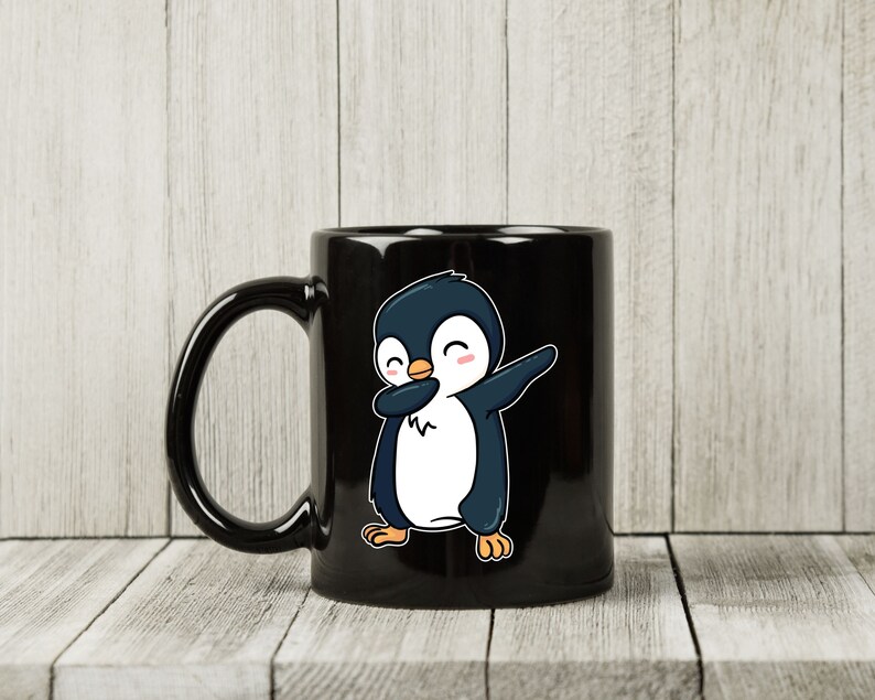 May include: Black ceramic mug featuring a cartoon penguin in a dabbing pose. The penguin is colored in shades of blue, white, and orange, with a cheerful expression. The mug has a curved handle and a glossy finish, suitable for hot or cold beverages.